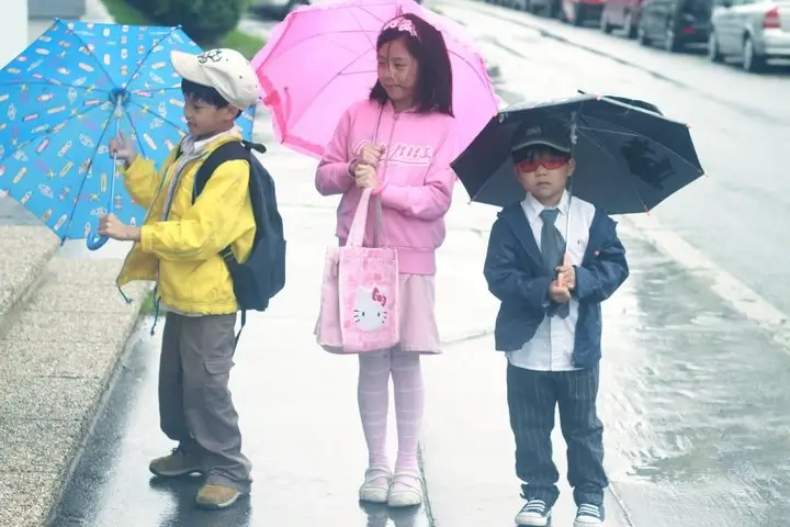 Of Umbrellas, Raincoats, and Rainboots, kids with umbrellas