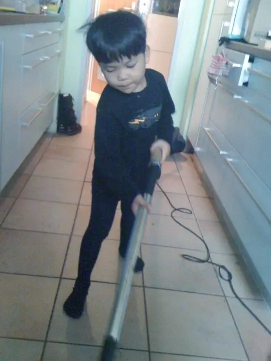 Send the Beloved Child on a Journey, child with vacuum cleaner
